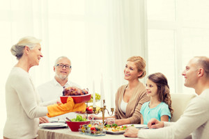 smiling family having holiday dinner at home